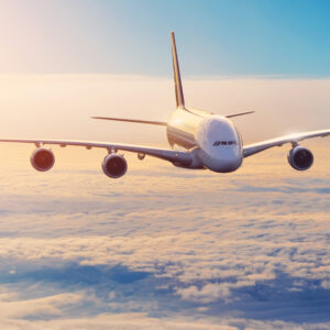Picture of an A380 above clouds with a sundown
